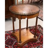 A round mahogany neo-empire table with brass gallery, 19th century. Resting on column legs with