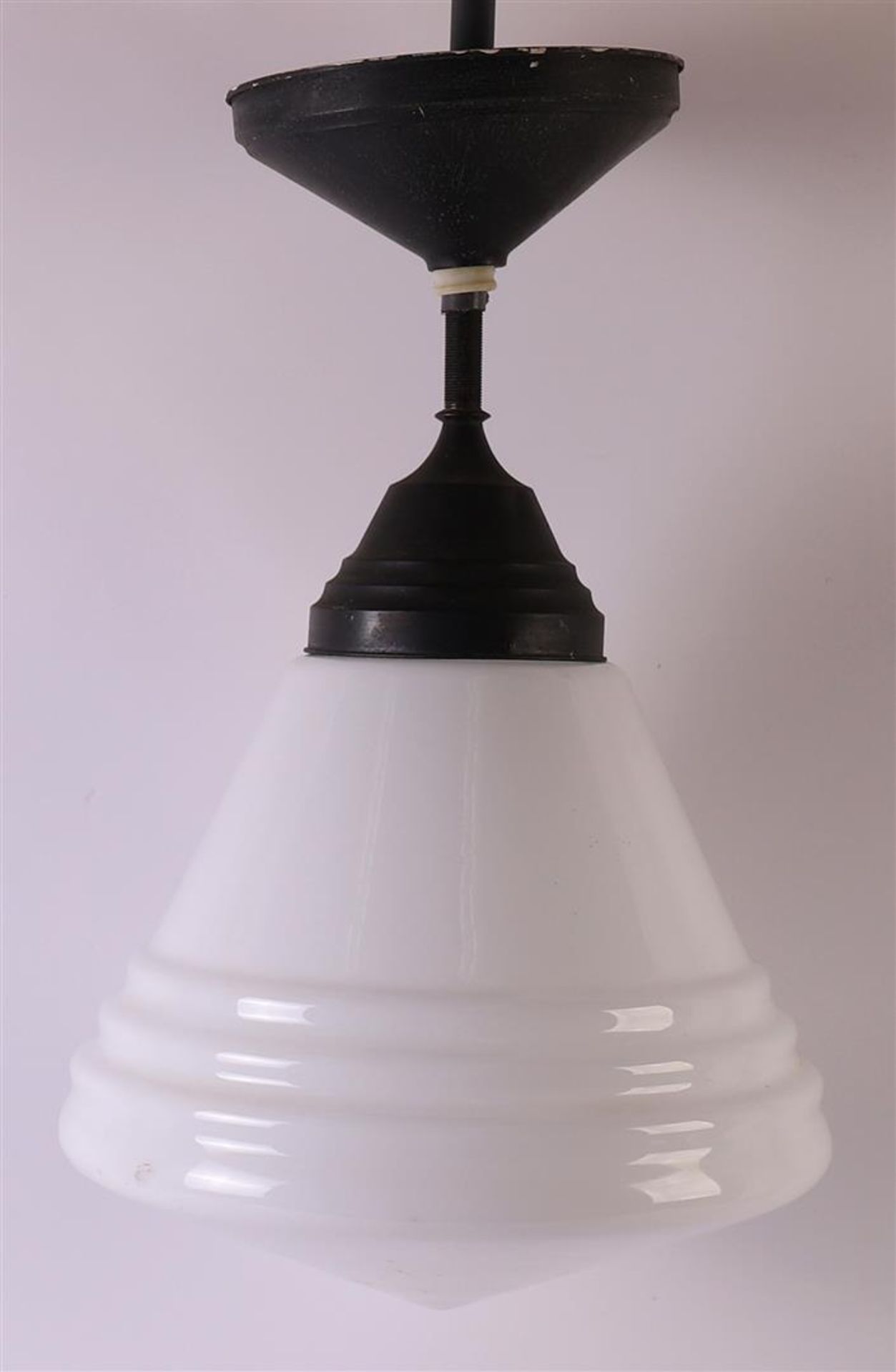 A chrome metal Art Deco hall lamp with white glass shade, ca. 1920, h 65 cm.