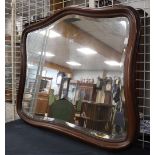 A facet cut mirror in a mahogany profile frame, 1st half of the 20th century, h 90 x w 106 cm.