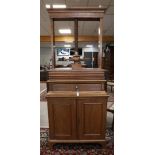 A linen press with drawer, 19th century. Oak, base cabinet with two panel doors, front resting on