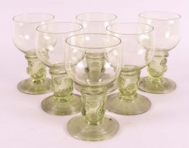 A series of six green glass Rhine wine stemmers with blackberry buds on the stem, around 1800, to.