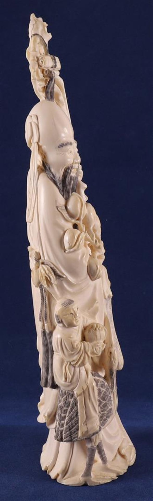 A carved ivory Shou Lao with staff and peaches in his hand, at his side a fool on a crane, China, - Image 10 of 14