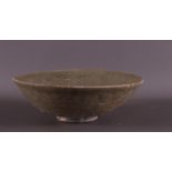 A green glazed stoneware bowl on stand ring, China, Song/Ming, h 6.5 x Ø 20 cm.