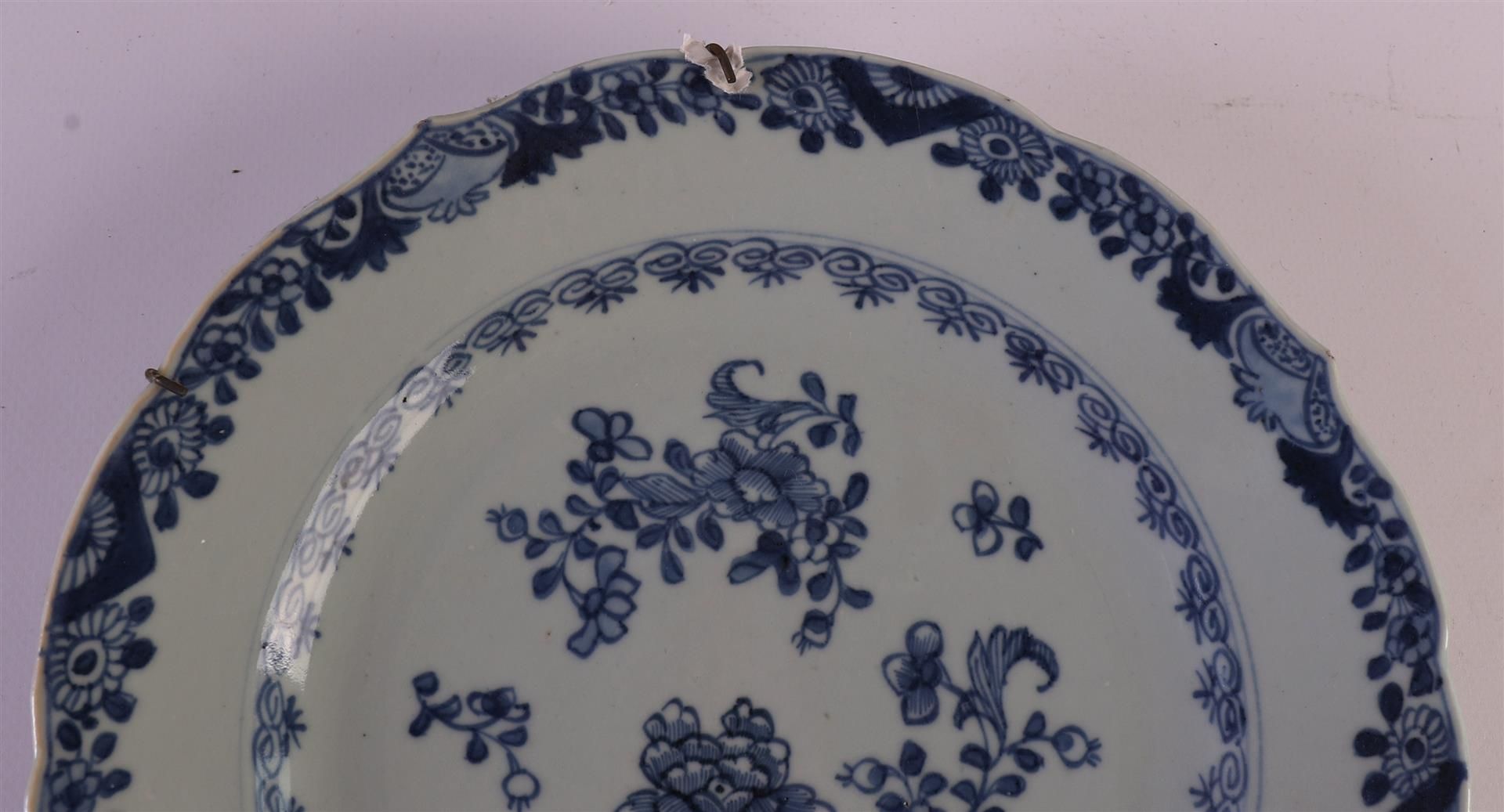 Four blue/white porcelain contoured plates, China, Qianlong (1736-1795). Blue underglaze floral - Image 6 of 12