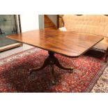 A rectangular mahogany tilt top table, England, 18th century. Baluster-shaped trunk, resting on