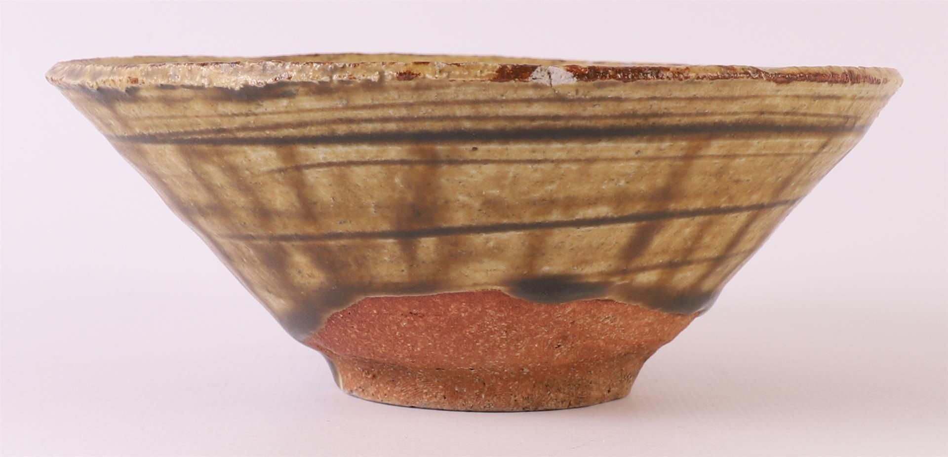 A brown glazed earthenware conical Temmoku bowl, China, Song dynasty 12th century, h 5 x Ø 13.5 - Image 3 of 8