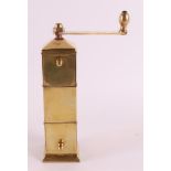 A square brass Art Deco pepper mill, in the style of Jan Eisenloeffel, ca. 1930, h 19 cm.