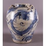 A baluster-shaped Swatow martavan, China, Ming, 16th century. Blue underglaze decor of dragon with