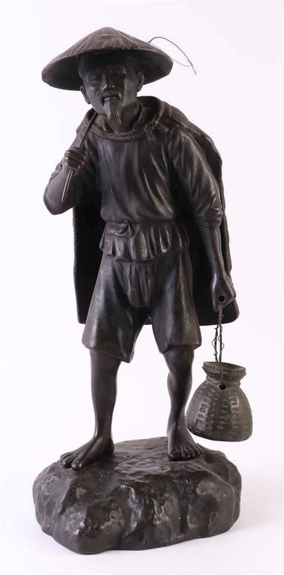 A dark patinated bronze okimono of a fisherman, Japan, Meiji, around 1900, h 36 cm.