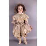 A limbed doll with a porcelain head, Germany, ca. 1906. Marked: Schoenau & Hoffmeister Germany, no.