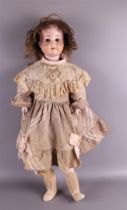 A limbed doll with a porcelain head, Germany, ca. 1906. Marked: Schoenau & Hoffmeister Germany, no.