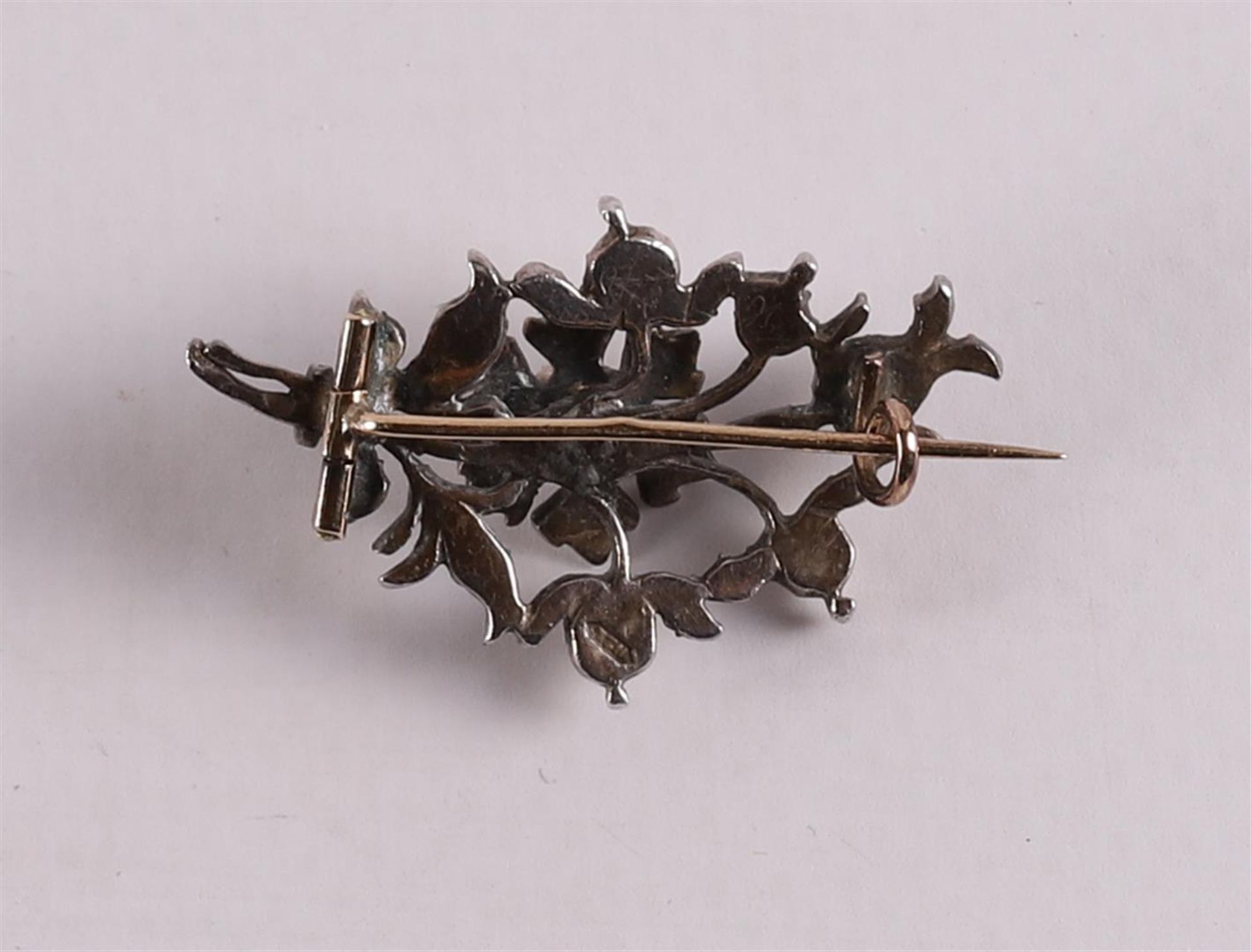 A gold on silver branch brooch, set with rose cut diamonds, 19th century, gross weight 5.5 grams, - Image 2 of 2