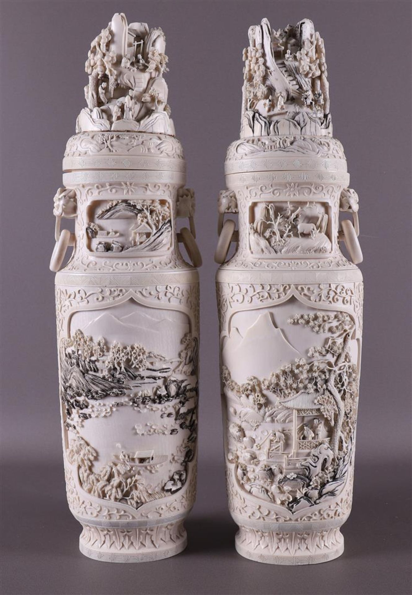 A pair of carved ivory baluster-shaped lidded vases with ringed lion heads as ears, China, Qing - Image 11 of 28