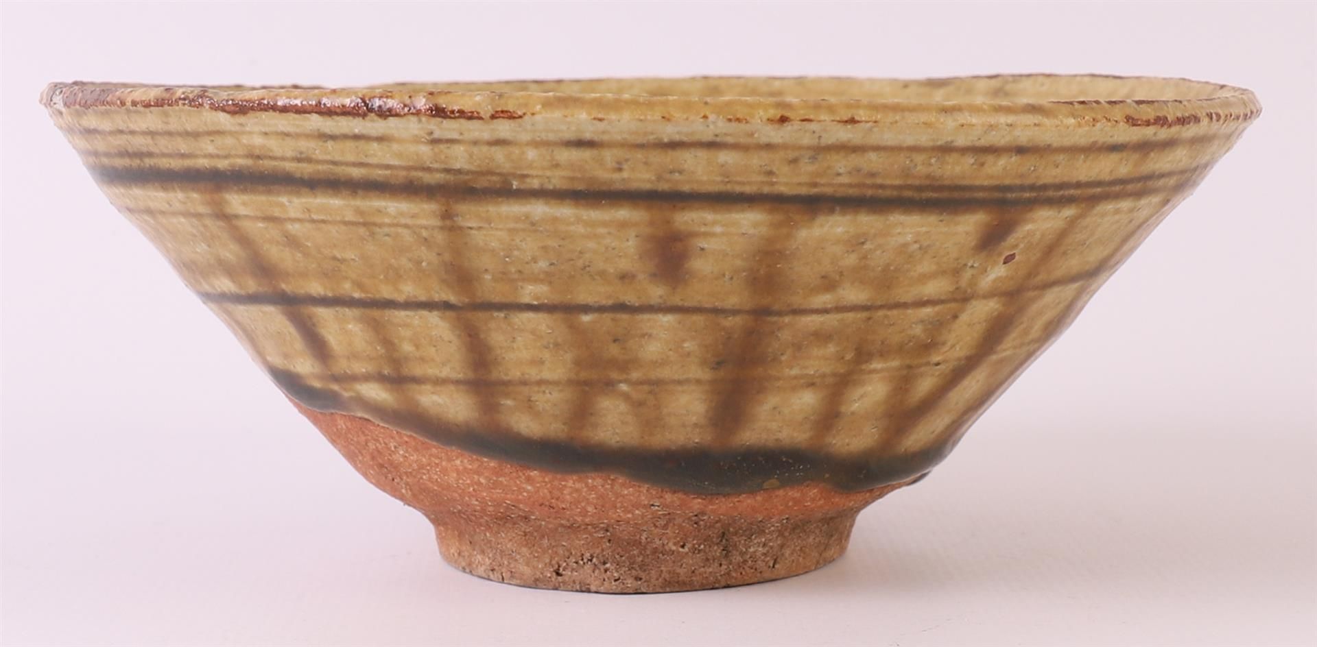 A brown glazed earthenware conical Temmoku bowl, China, Song dynasty 12th century, h 5 x Ø 13.5 - Image 4 of 8