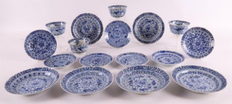 A series of four porcelain contoured cups and seven saucers, China, Kangxi style, 19th century. Blue