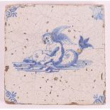 A blue/white tile with a decor of putti on a dolphin, Holland, 17th century, h 12.8 x w 12.8 cm.