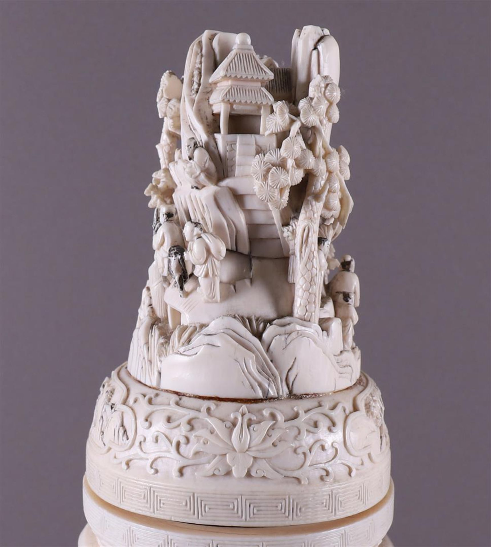 A pair of carved ivory baluster-shaped lidded vases with ringed lion heads as ears, China, Qing - Image 8 of 28
