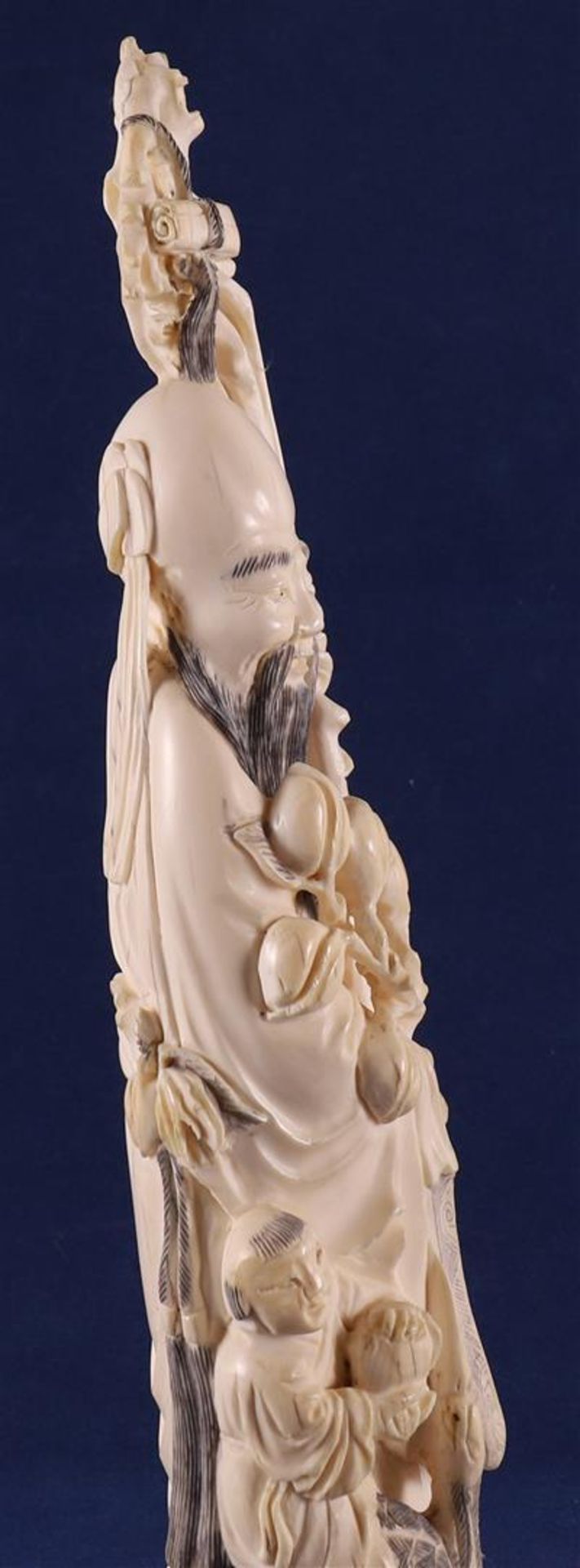 A carved ivory Shou Lao with staff and peaches in his hand, at his side a fool on a crane, China, - Image 11 of 14