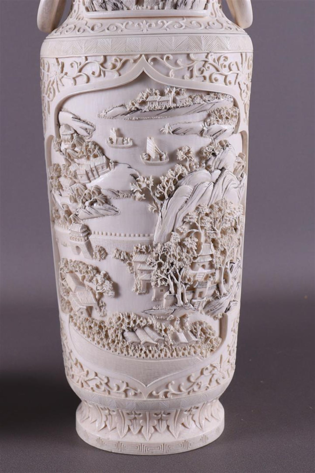 A pair of carved ivory baluster-shaped lidded vases with ringed lion heads as ears, China, Qing - Image 4 of 28