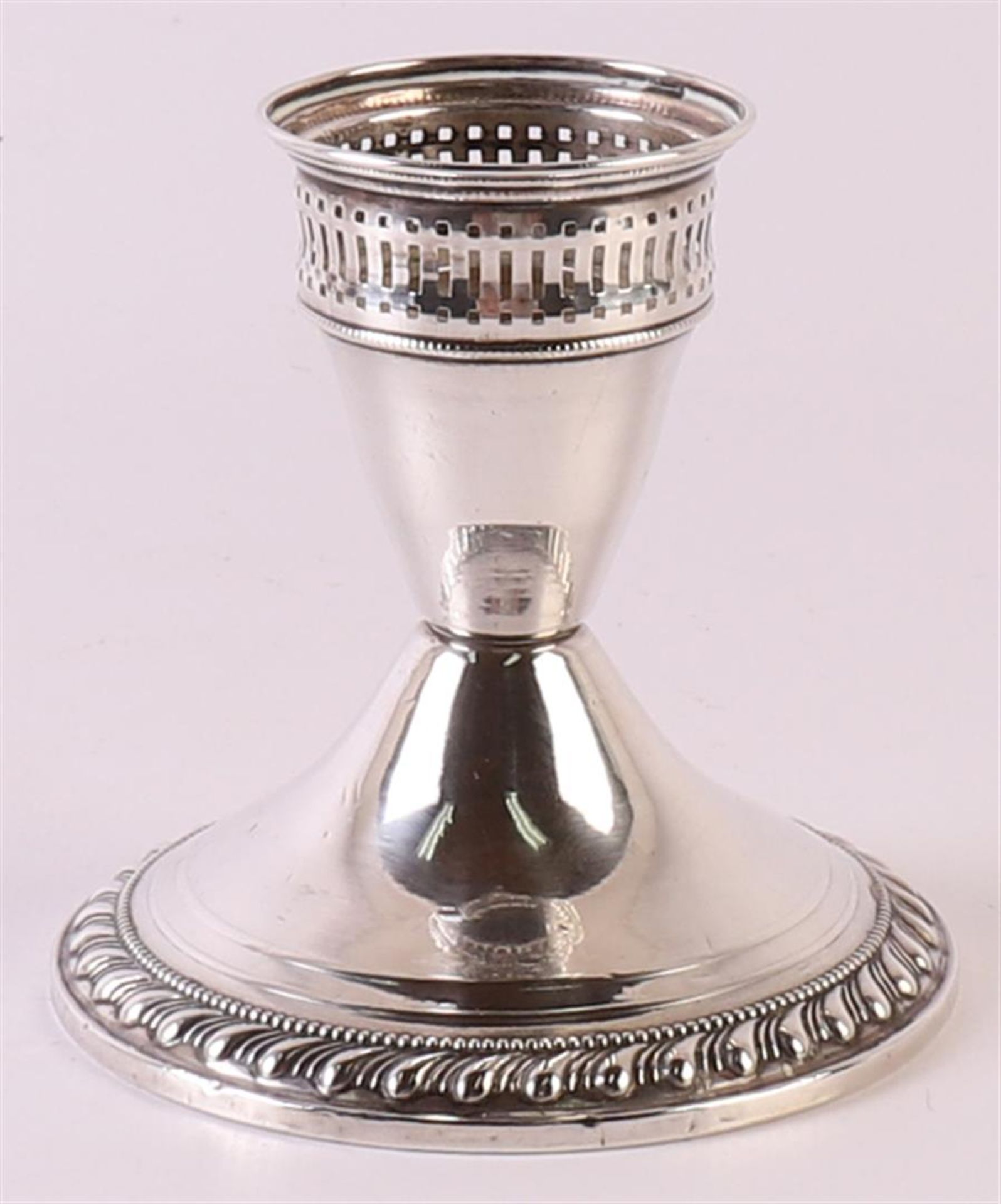 A first grade 925/1000 silver 1-light candlestick with gallery and weighted base. Gross weight 164