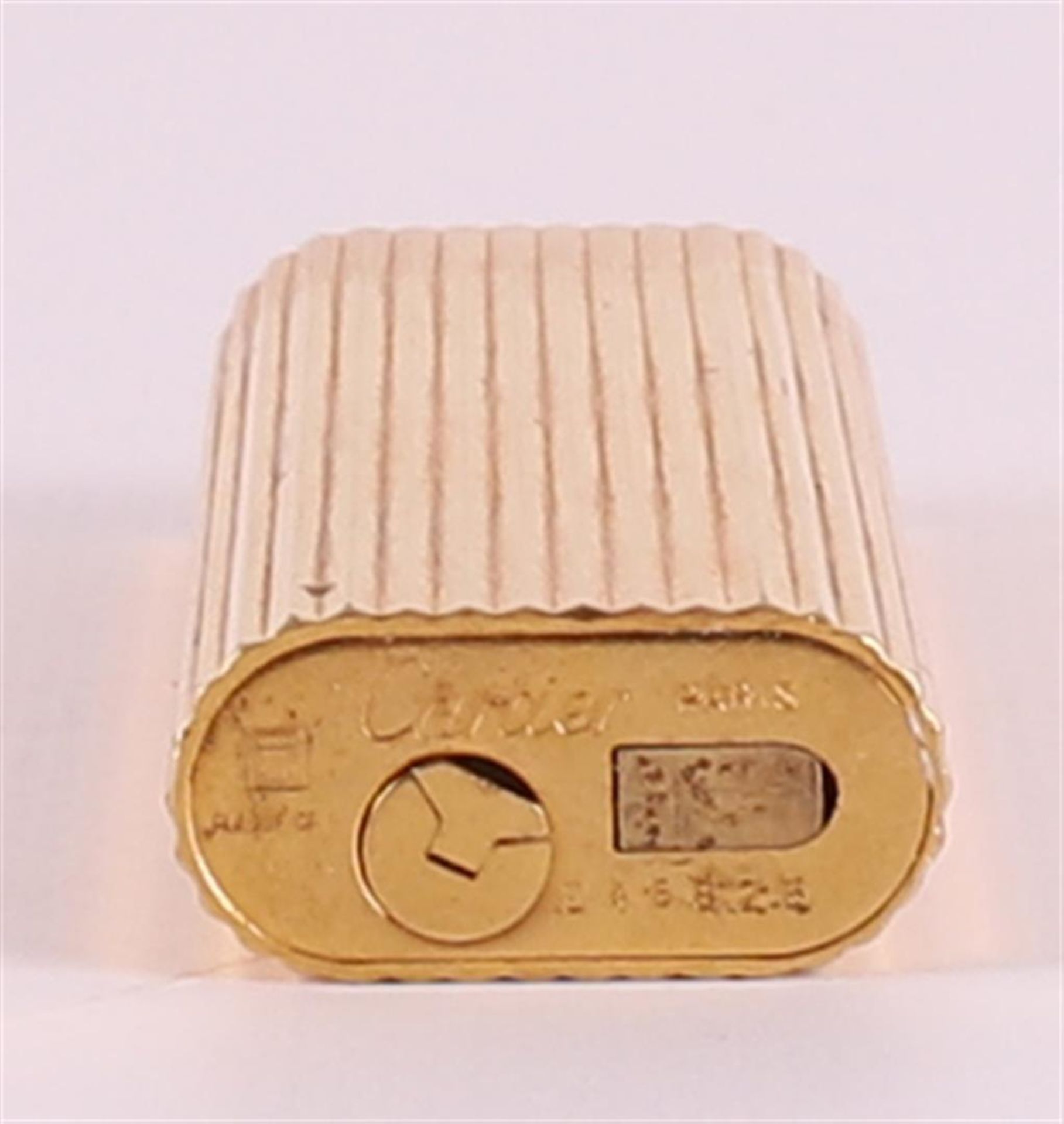 A gold-plated cigarette lighter, marked 'Cartier, Paris 'E 46828', height h 7 x w 2.5 cm. - Bild 4 aus 4