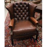 A brown leather ladies' Chesterfield model ear crapaud, padded back frame, 20th century. Seat height
