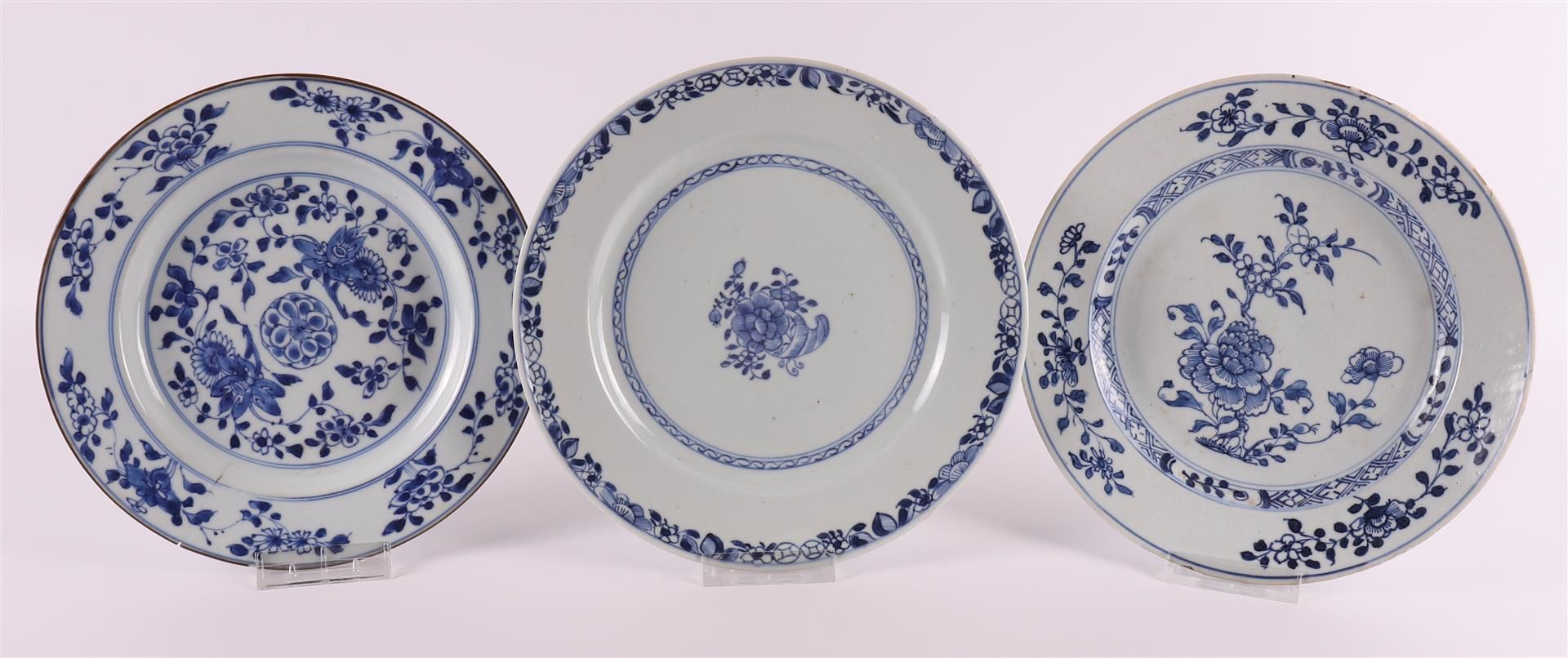 Three various blue/white porcelain plates, China, Qianlong 18th century. Blue underglaze floral