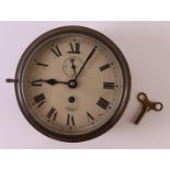 A ship's clock in a brass casing, England, ca. 1900. Signed: Smith Empire, Ø 18.5 cm.