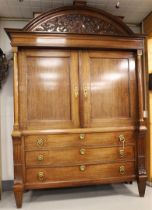 A two-door cabinet, Northern Netherlands, Neo Classicist, early 19th century. Oak, curved profiled