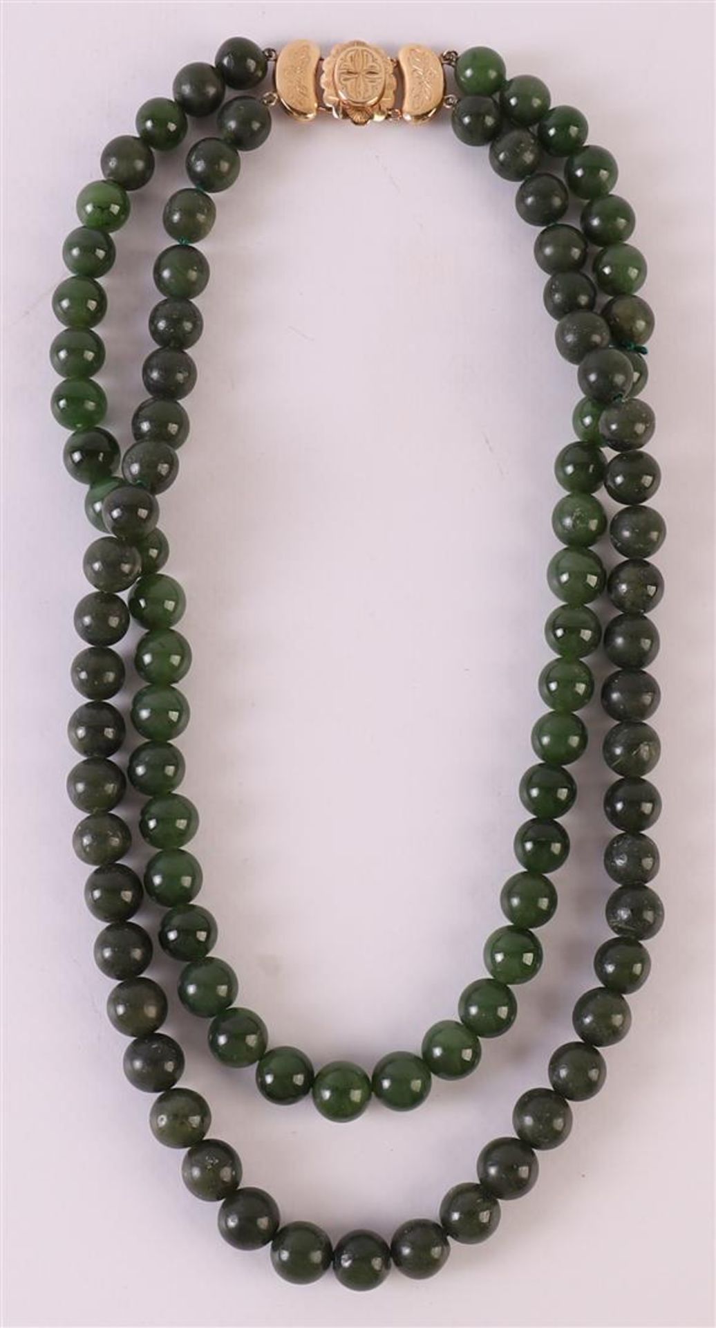 A 2-row necklace of aventurine beads, approximately 10mm thick with a 14 carat 585/1000 gold hook