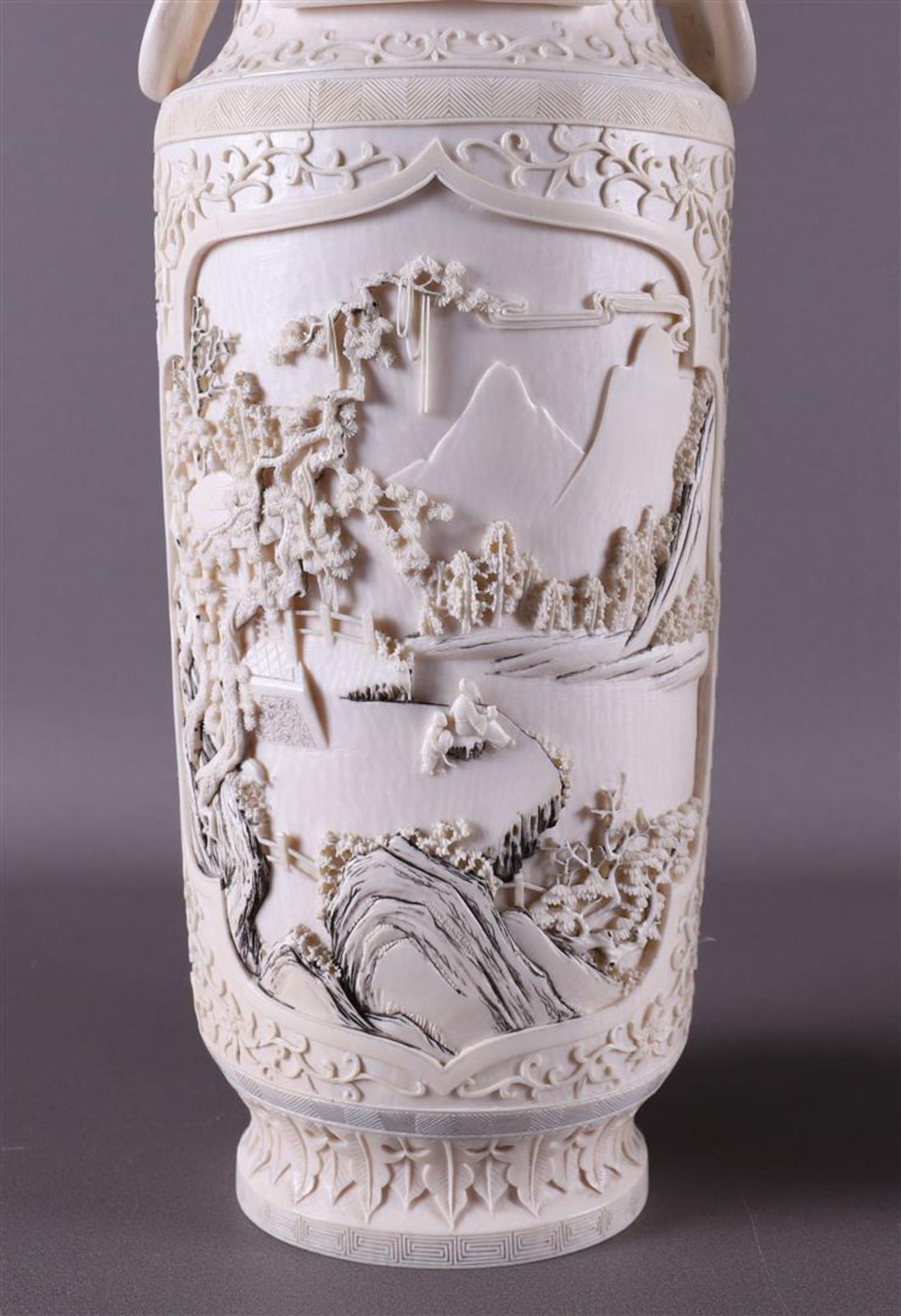 A pair of carved ivory baluster-shaped lidded vases with ringed lion heads as ears, China, Qing - Image 2 of 28