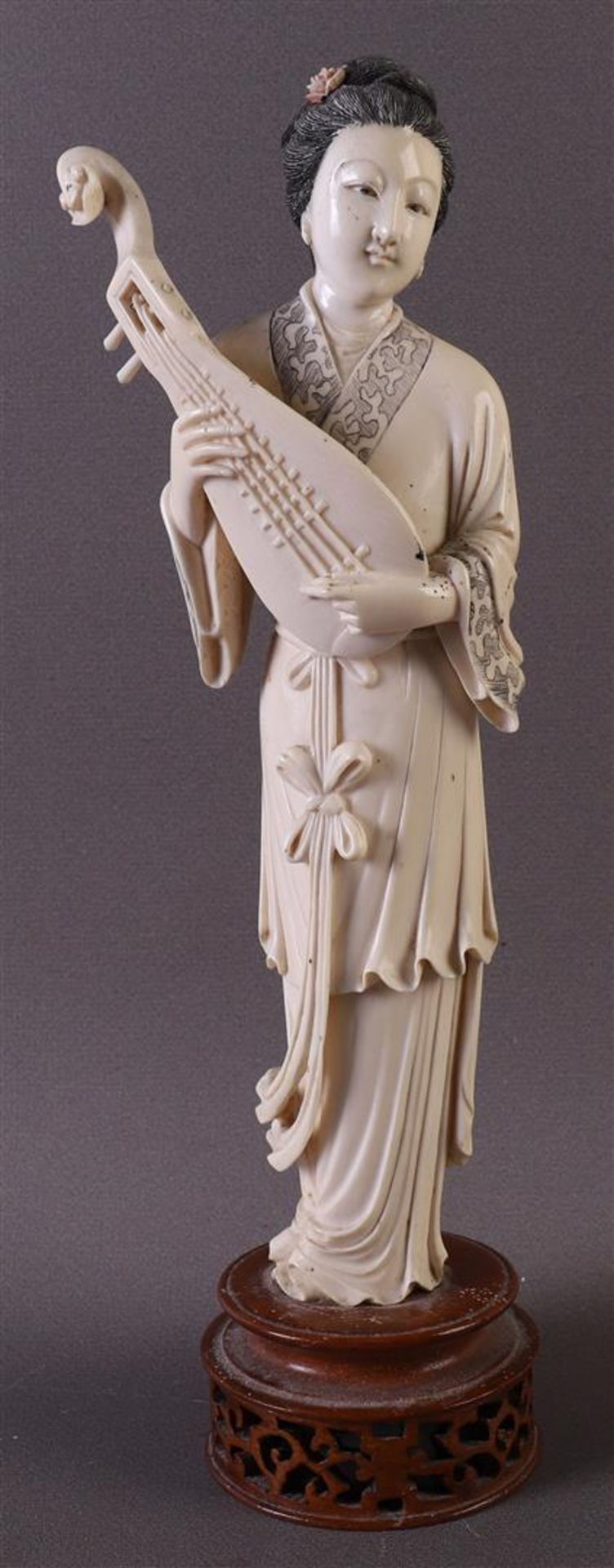A carved ivory Guanyin, so-called immortal 'He / Please note: This lot contains ivory and is