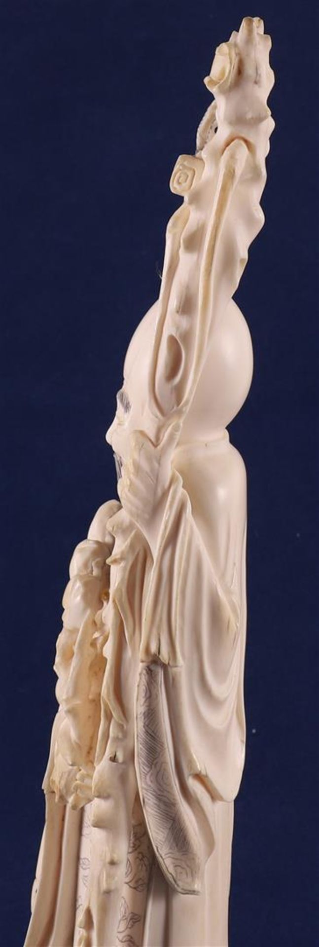 A carved ivory Shou Lao with staff and peaches in his hand, at his side a fool on a crane, China, - Image 5 of 14