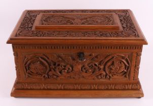 A rectangular carved wooden jewelry box, 1st half of the 20th century. Carved decor of putti and