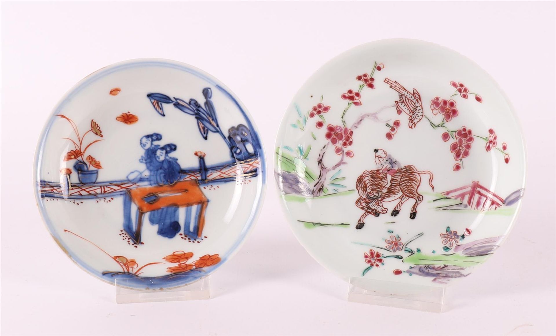 A porcelain saucer, China, Youngzheng, 18th century. Polychrome decor of a fool riding an ox and a