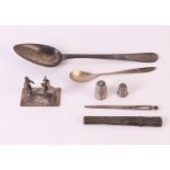 A lot of various silver, including a miniature of a man on a scaffold, needle case and spoon,