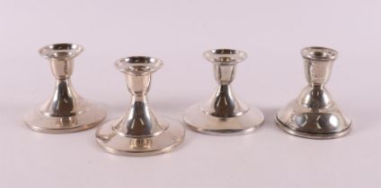 Four second grade 835/1000 silver candle holders, 20th century