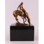 Hussmann, Albert Hinrich (1874-1946) A bronze female nude on horseback.