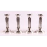 Four silver one-light column candlesticks on a round profiled base, 20th century