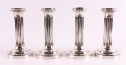 Four silver one-light column candlesticks on a round profiled base, 20th century