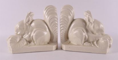 A pair of earthenware Art Deco bookends in the shape of squirrels, France,
