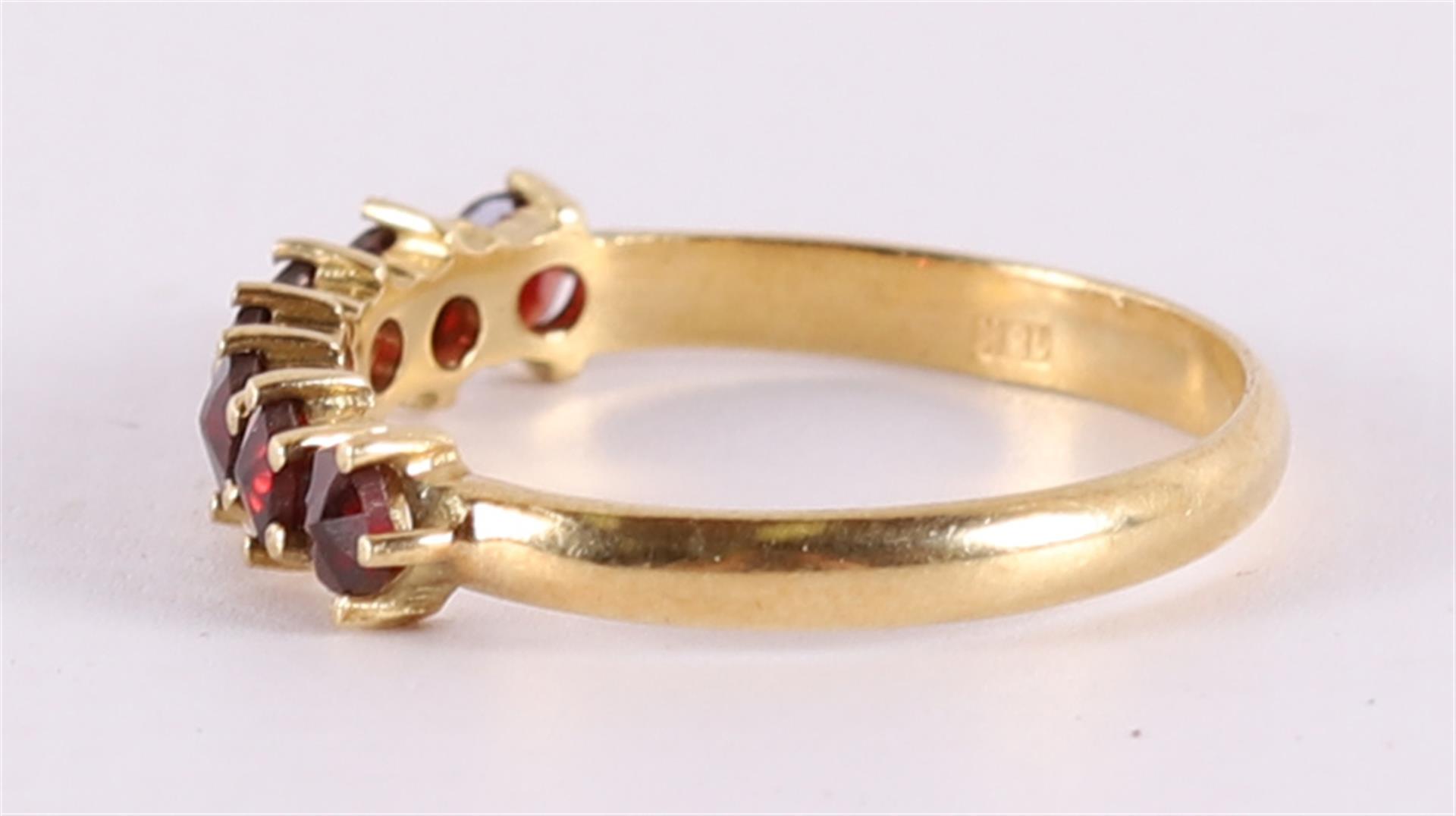 An 18 kt gold row ring with facet cut Bohemian garnets. - Image 2 of 2