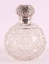 A spherical crystal odor flask with silver valve closure, England