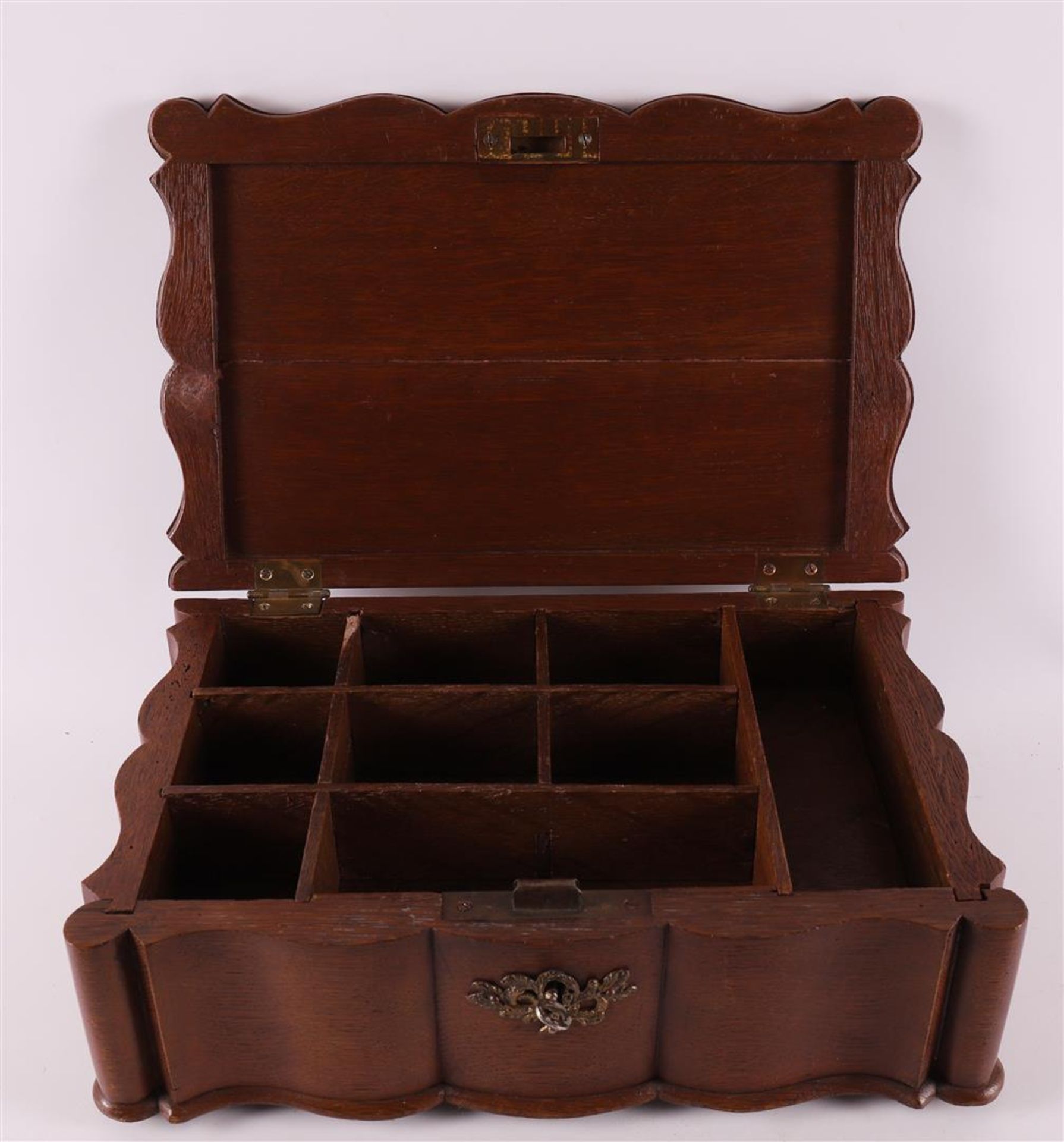 An organ-curved oak document box, 18th century.