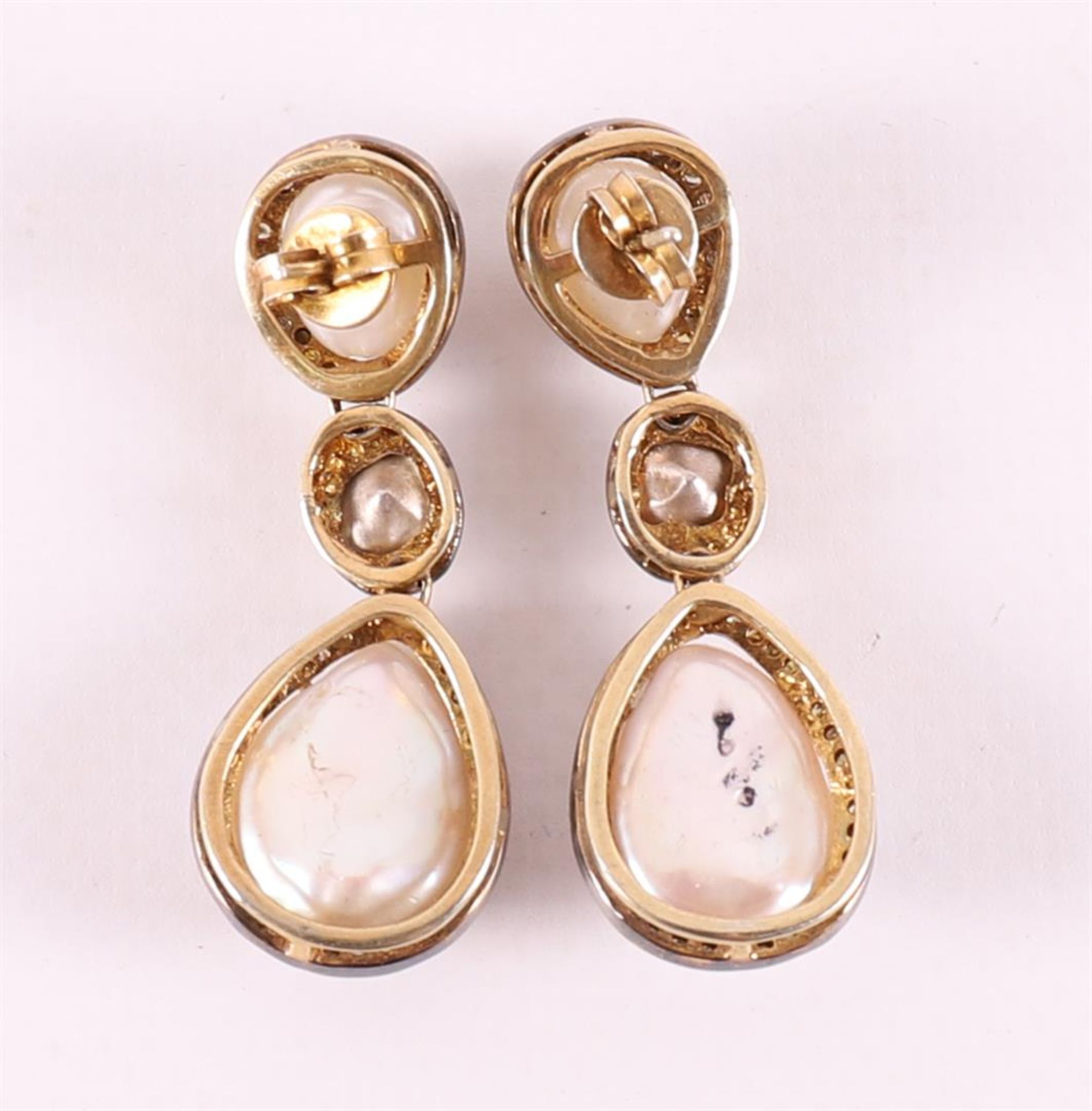 A pair of partly gold-plated silver earrings with 4 pearls, surrounded by diamon - Image 2 of 2