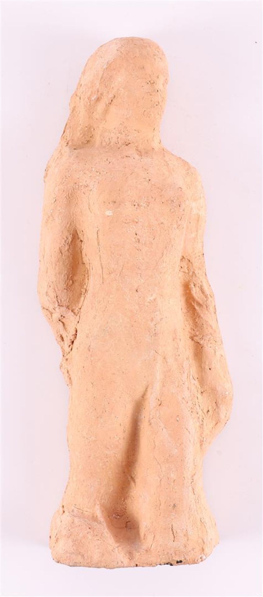 A terracotta sculpture of a female standing nude, style of Hildo Krop.