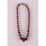 An ascending faceted carnelian necklace with a 14 kt gold clasp.