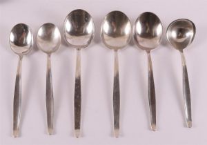 Three various second grade 835/1000 silver serving spoons and a tablespoon, from
