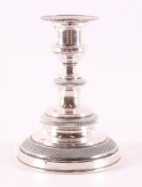 A 3rd grade 800/1000 silver 1-light candlestick, weighted base, 20th century.