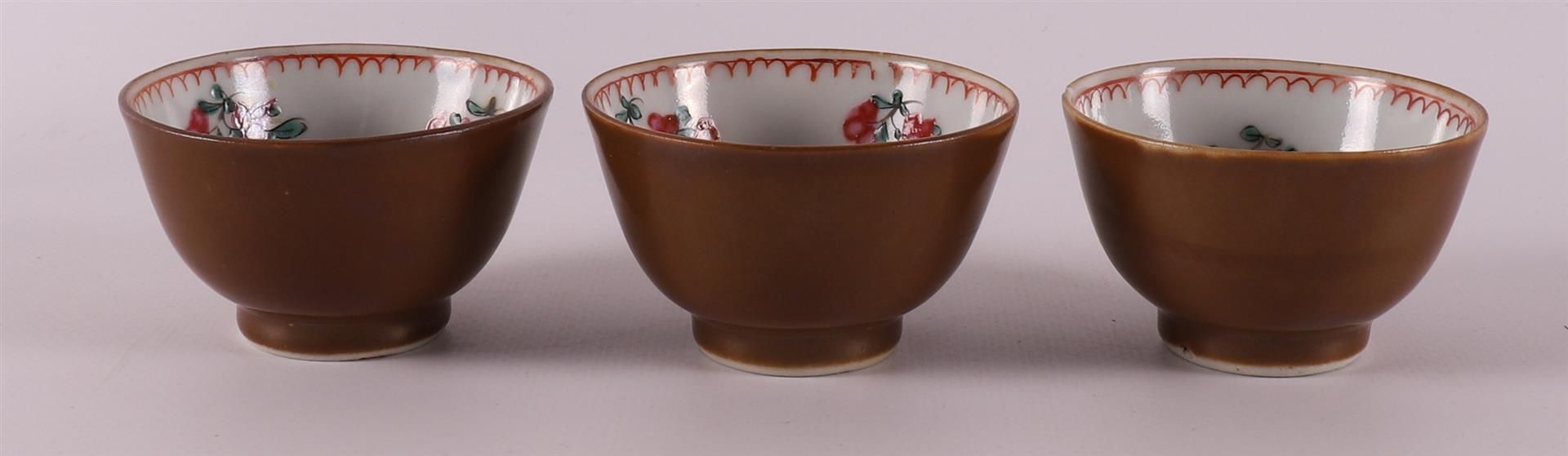 Three famille rose cups and saucers on capucine ground, China, Qianlong, 18th ce - Image 5 of 9